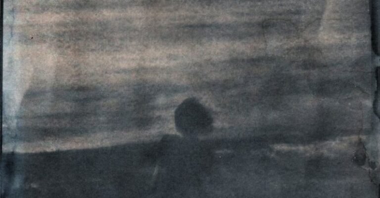 Techniques - Blurry View of Woman in Dress Standing at Seashore in Cyanotype Technique