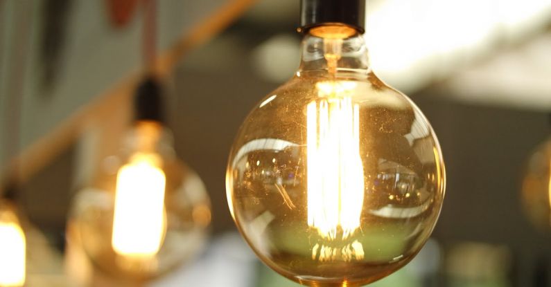 Efficiency - Lighted Light Bulb in Selective-focus Photography