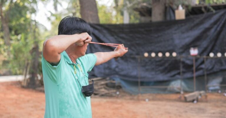 Competitions - A man is holding a bow and arrow